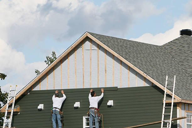 Professional Siding technician working in Mead, CO